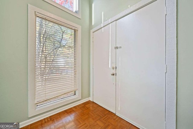 foyer with parquet flooring