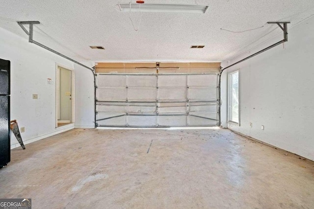 garage with black fridge