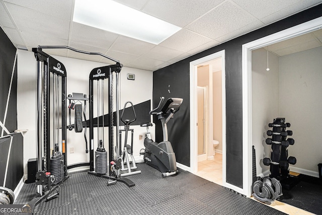 exercise room featuring a paneled ceiling