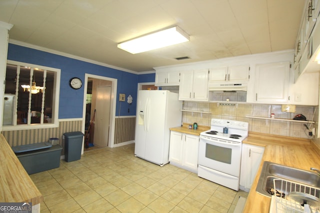 kitchen featuring butcher block counters, white cabinetry, a chandelier, white appliances, and light tile patterned floors