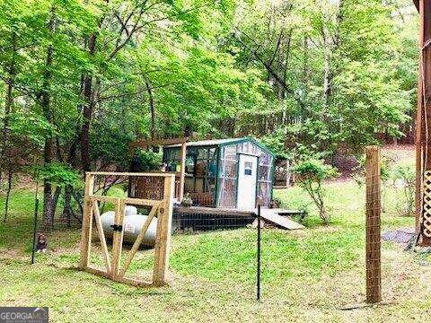 exterior space with an outbuilding and a yard