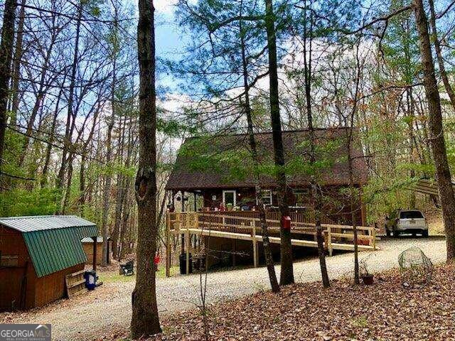 back of property featuring a deck