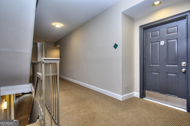 interior space featuring carpet and baseboards