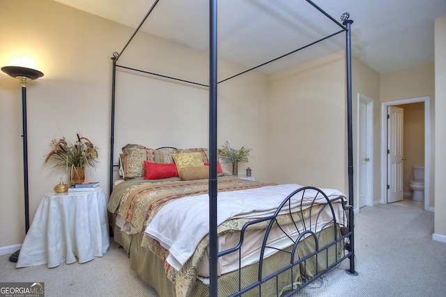 bedroom with carpet floors and baseboards