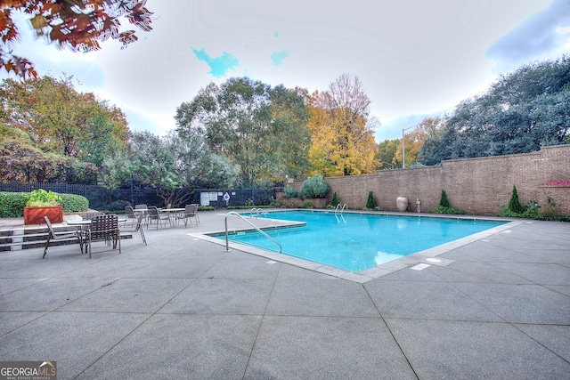 view of pool featuring a patio area