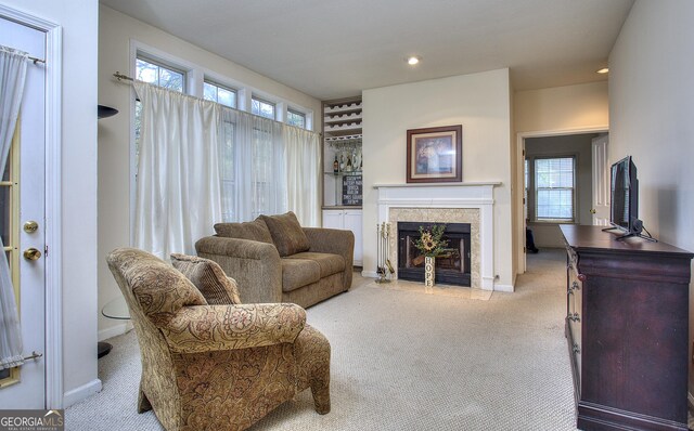 interior details with a fireplace and carpet floors