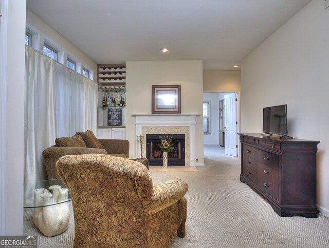 living room featuring light carpet and plenty of natural light