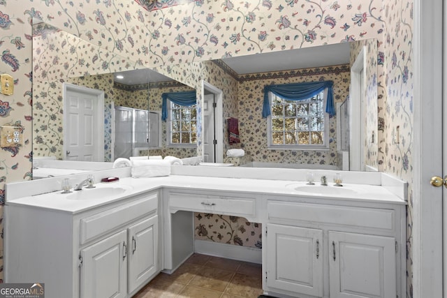 bathroom with tile patterned floors, vanity, and an enclosed shower