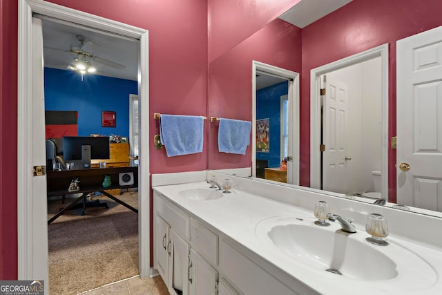 bathroom with tile patterned flooring, vanity, toilet, and ceiling fan