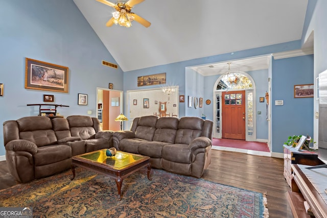 living room featuring crown molding, high vaulted ceiling, wood-type flooring, and ceiling fan with notable chandelier