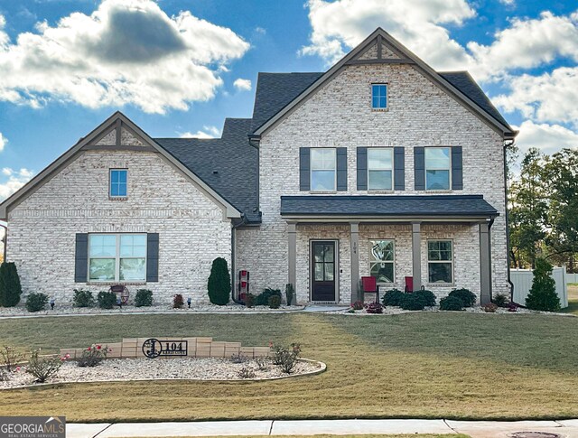 craftsman-style house with a front lawn