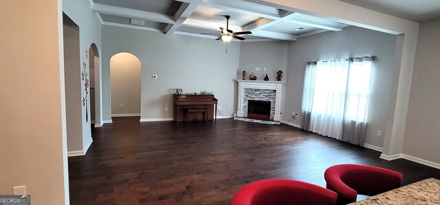 kitchen featuring dark hardwood / wood-style floors, light stone counters, a kitchen island with sink, and sink