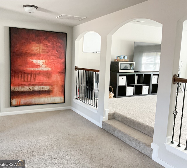 interior space featuring carpet