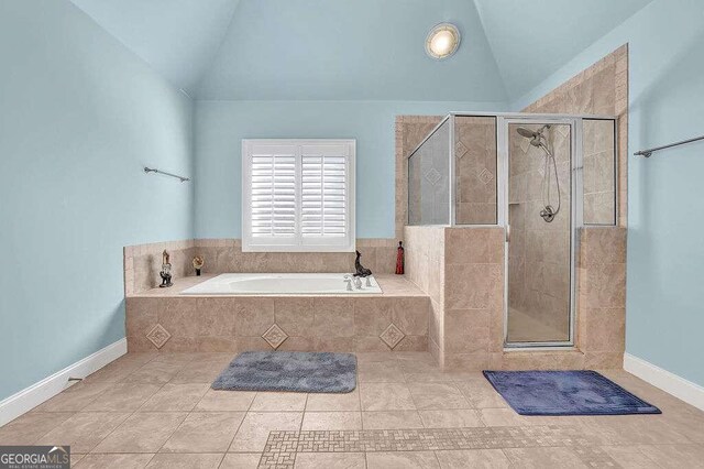 bathroom featuring tile patterned flooring, plus walk in shower, and high vaulted ceiling