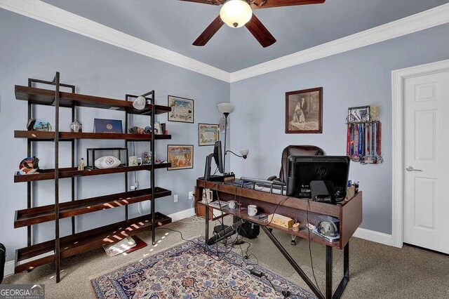 carpeted office space featuring ceiling fan and crown molding