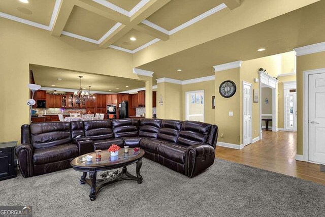 living room featuring beamed ceiling, hardwood / wood-style floors, crown molding, and coffered ceiling