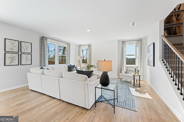 living room with a healthy amount of sunlight and light wood-type flooring