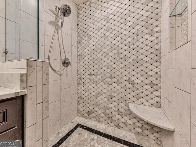 bathroom featuring tiled shower