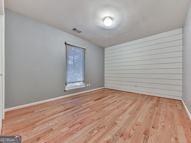 spare room featuring light hardwood / wood-style flooring