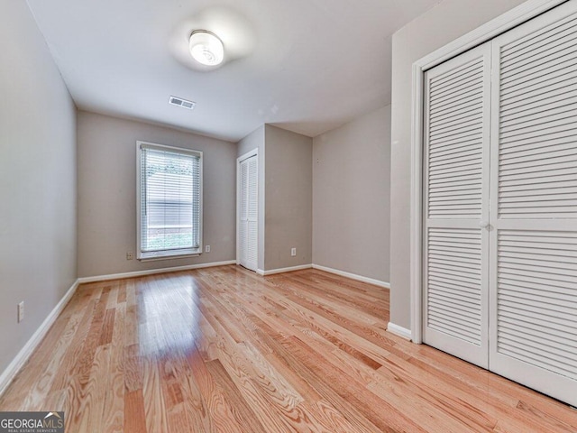 unfurnished bedroom with light hardwood / wood-style floors