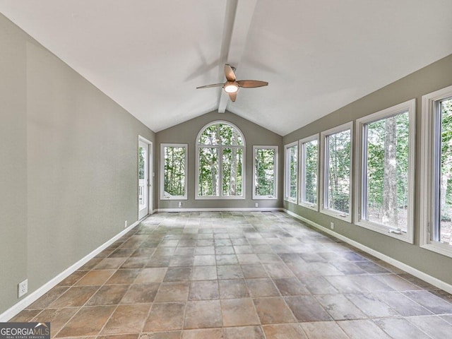 unfurnished sunroom with vaulted ceiling with beams and ceiling fan