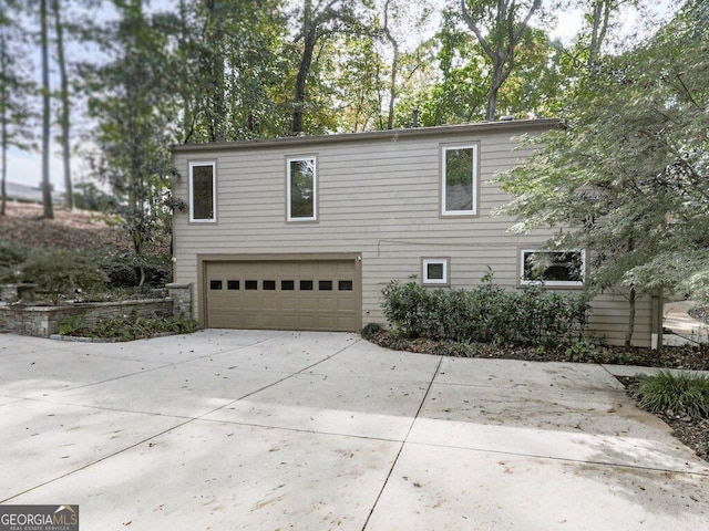 view of property exterior featuring a garage