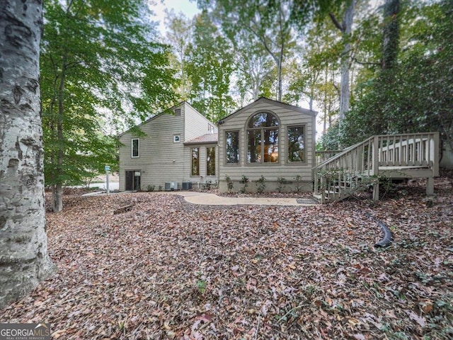 rear view of property featuring a deck