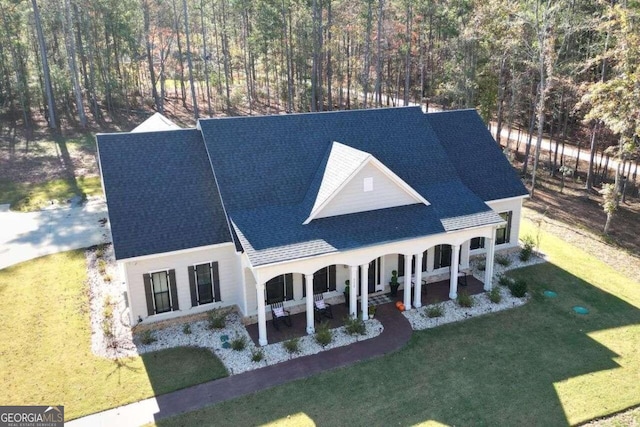 view of front of home featuring a patio and a front lawn