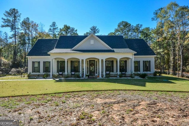 view of front of home featuring a porch and a front lawn