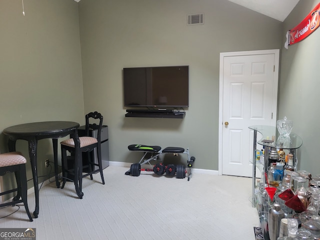 game room with lofted ceiling and light carpet