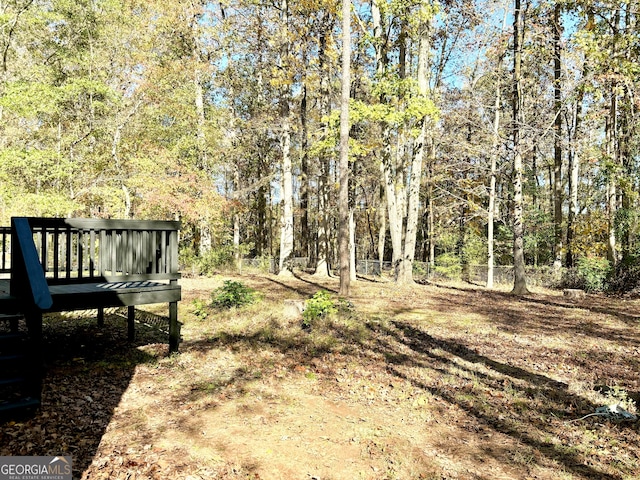 view of yard with a wooden deck