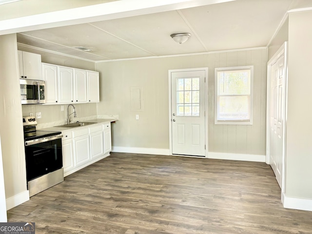 kitchen featuring dark hardwood / wood-style floors, white cabinetry, sink, and appliances with stainless steel finishes