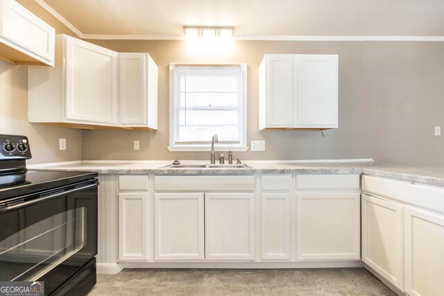 kitchen with white cabinetry, black / electric stove, crown molding, and sink