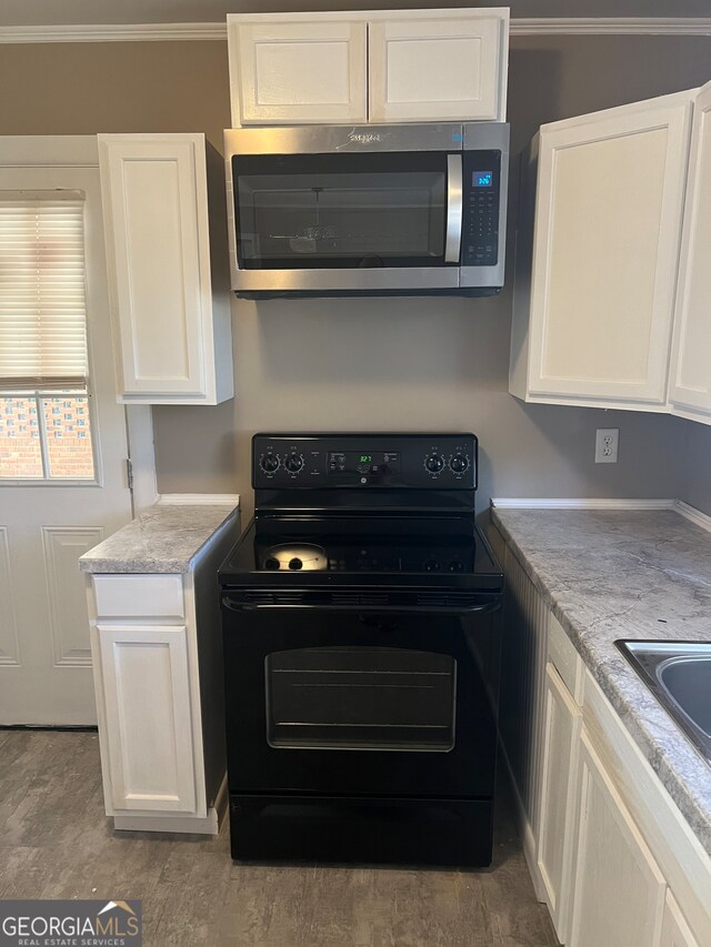 kitchen with white cabinets, decorative light fixtures, plenty of natural light, and sink