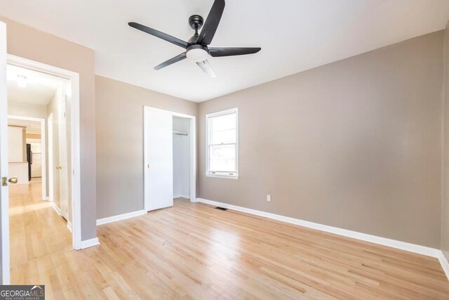 unfurnished room featuring ceiling fan and light hardwood / wood-style flooring