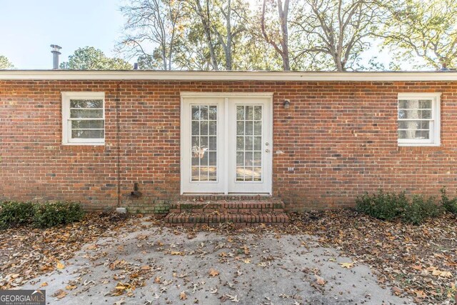 view of side of home with a carport and a yard