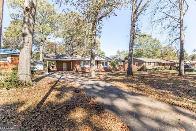 ranch-style house with a carport