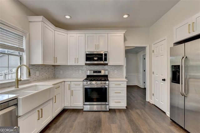 kitchen with white cabinetry, sink, and appliances with stainless steel finishes