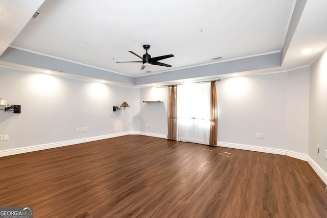 unfurnished room with ceiling fan, dark hardwood / wood-style flooring, and crown molding