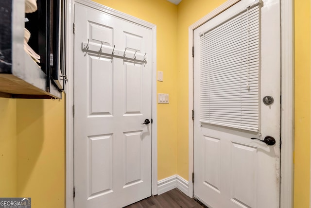 doorway featuring dark wood-type flooring