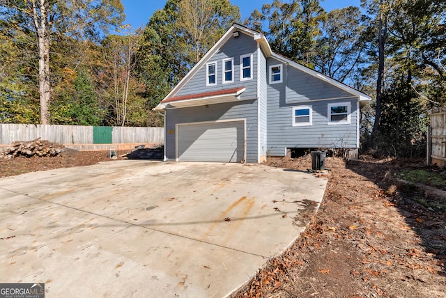 view of side of home featuring a garage