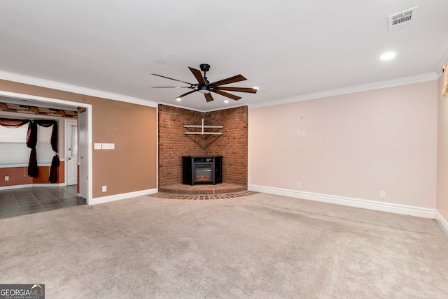 unfurnished living room with ceiling fan, dark carpet, and ornamental molding