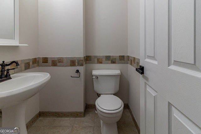 bathroom featuring tile patterned floors, sink, and toilet