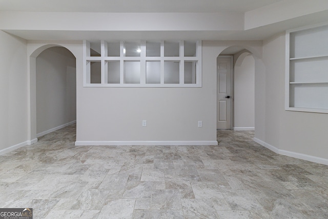 spare room with built in shelves