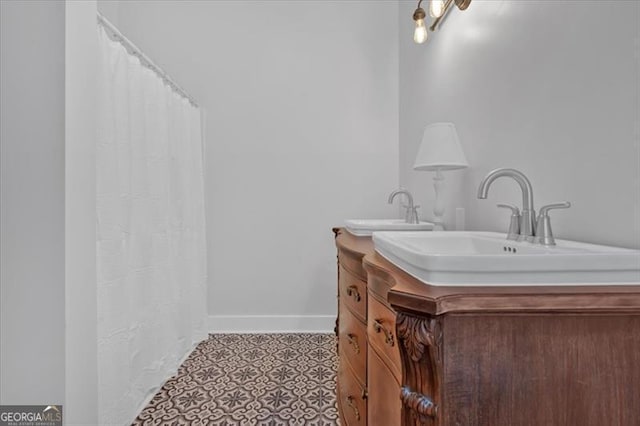 bathroom featuring tile patterned flooring and vanity