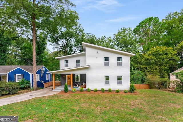 view of front facade with a front lawn and a porch