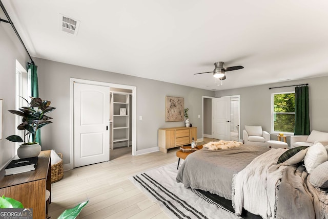 bedroom with ceiling fan and light hardwood / wood-style flooring