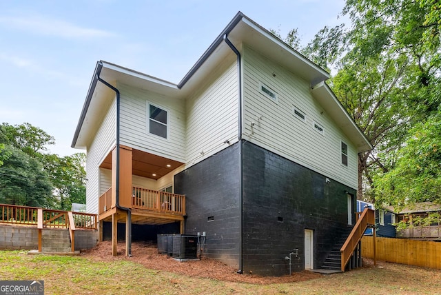 rear view of property featuring cooling unit