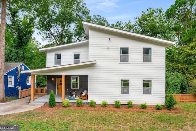 view of front of house with a front lawn and a porch