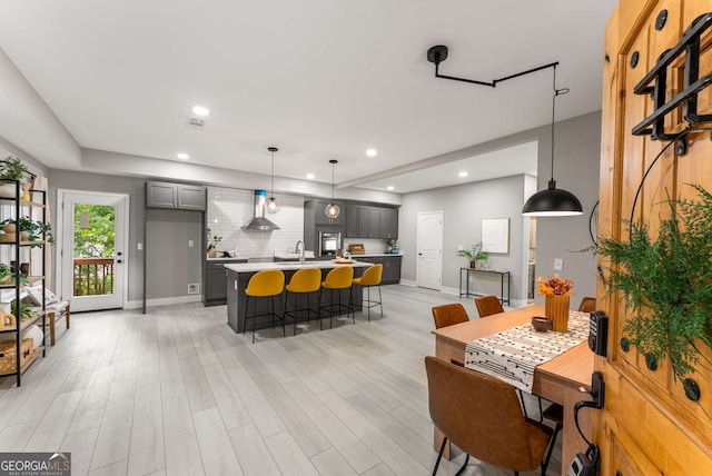 dining room with light hardwood / wood-style flooring